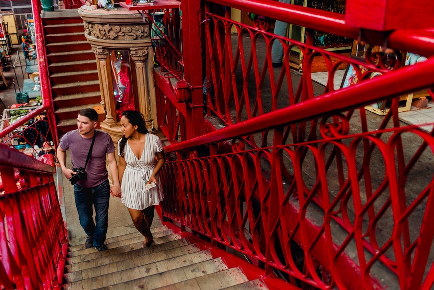 Spanish and Go founders Jim and May walking up red staircase