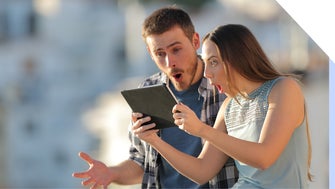 Couple are amazed at content they see on a tablet
