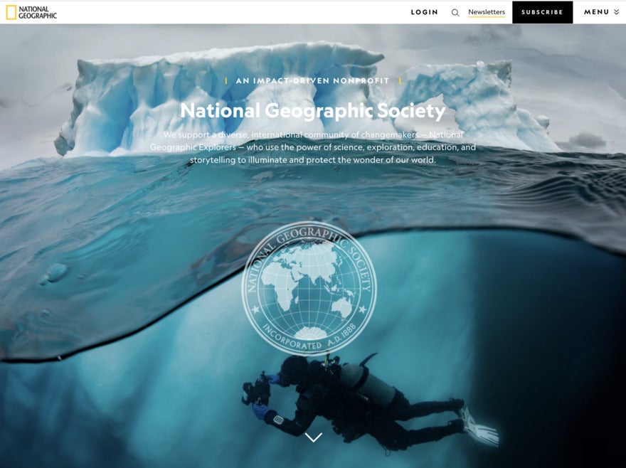 National Geographic photos A screenshot of the NatGeo website featuring a photo of clear, green artic water - ice on top and a diver underneath.