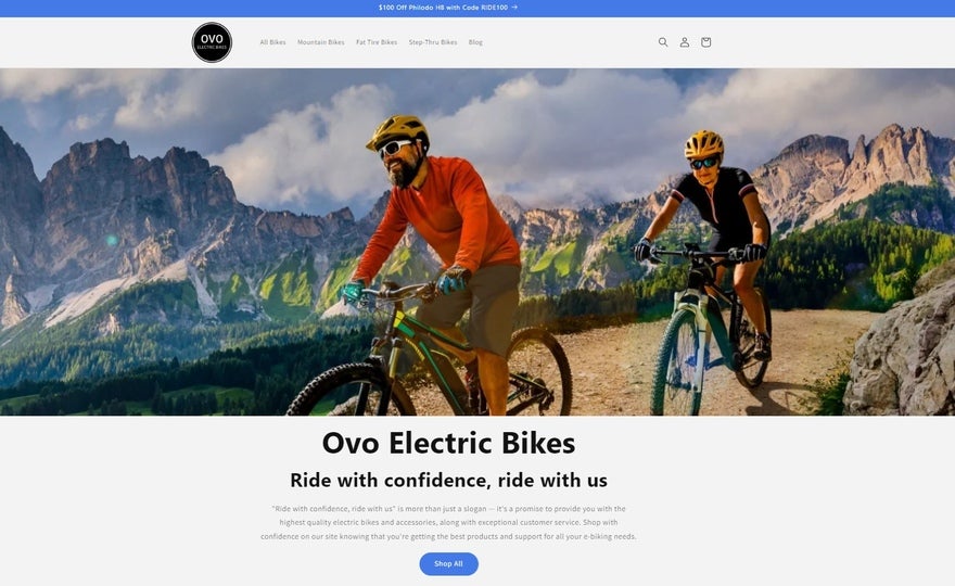 Ovo Bikes Homepage The Ovo homepage, showing two men riding electric bikes on a mountain pass with black text underneath.