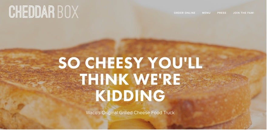 Cheddar box Grilled cheese sandwich on a plate.
