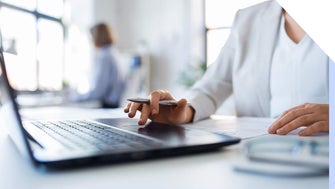 Professional woman working at a laptop