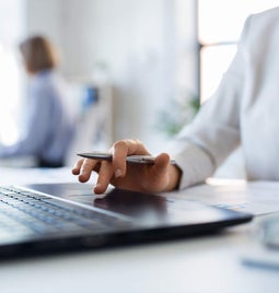 Professional woman working at a laptop