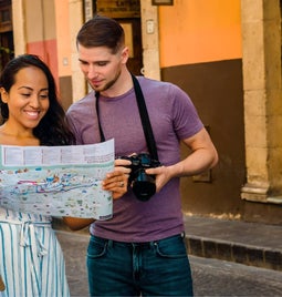 Photo of Jim and May looking at a map