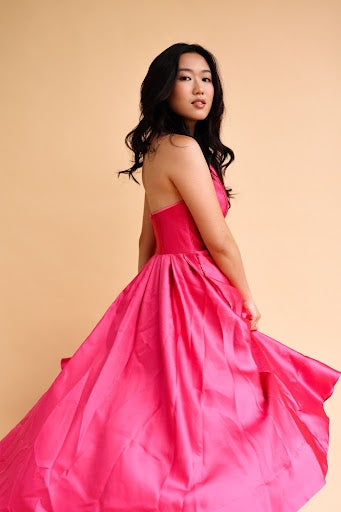 viveca chow model photo of a woman in a pink dress