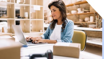 woman at a laptop in a shop