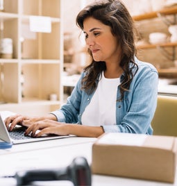 woman at a laptop in a shop