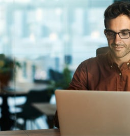 man at laptop working