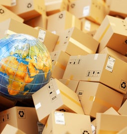 A globe surrounded by parcels.