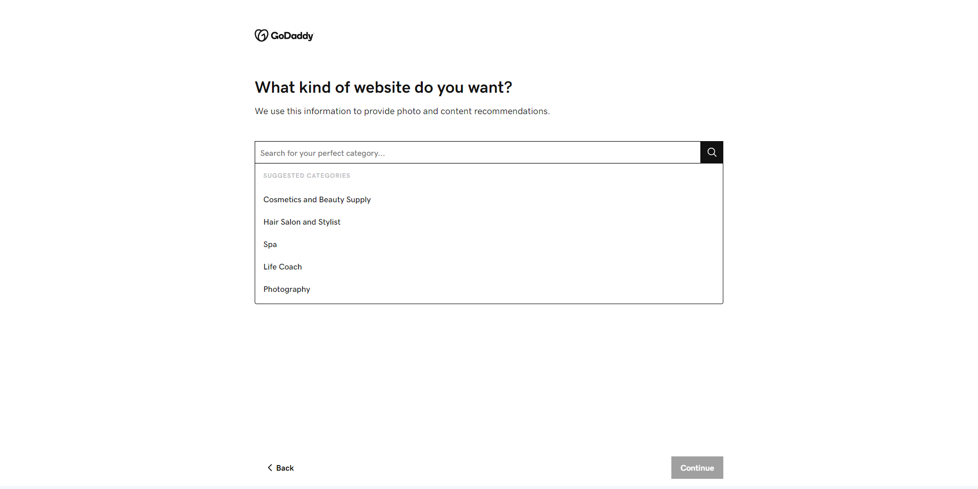 GoDaddy layout options a white search bar with suggested topics for website themes