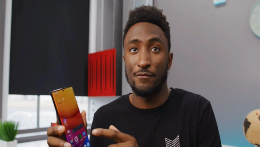 Endorser Social media endorser Marques Brownlee giving advice on a smart phone