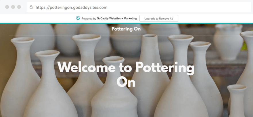 GoDaddy free test website for a pottery business, showing the GoDaddy free ad banner