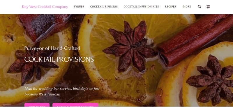 homepage for cocktail website featuring cut oranges and spices