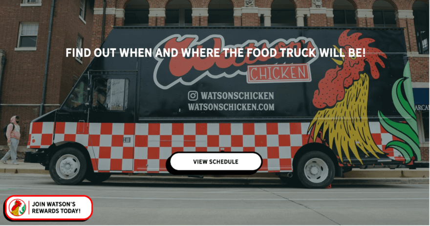 Watsons A Watson's Chicken food truck parked in front of a brick building. The truck is white with a red and black logo. The text on the truck says "WATSON'S CHICKEN | Fried Chicken Sandwiches | WATSONSCHICKEN.COM."