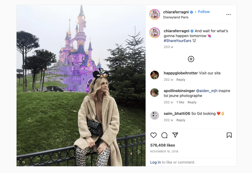 #ShareYourEars campaign Instagram post of a woman sitting in front of the Disneyland castle, taking part in Disney's #ShareYourEars campaign.