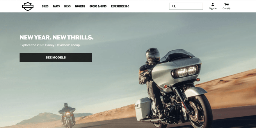 Harley Davidson homepage image of two bikers driving on desert road